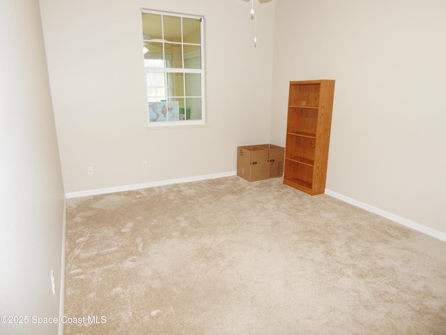 4590 Brantford Ct, Rockledge, FL 32955 - carpeted empty room featuring a ceiling fan and baseboards