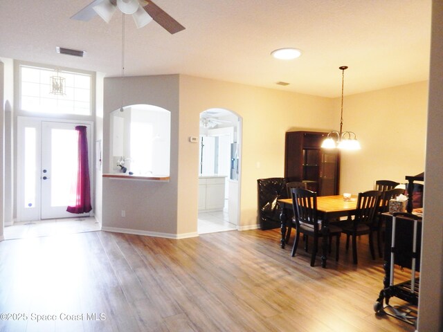 4590 Brantford Ct, Rockledge, FL 32955 - dining space with ceiling fan, wood finished floors, arched walkways, and baseboards