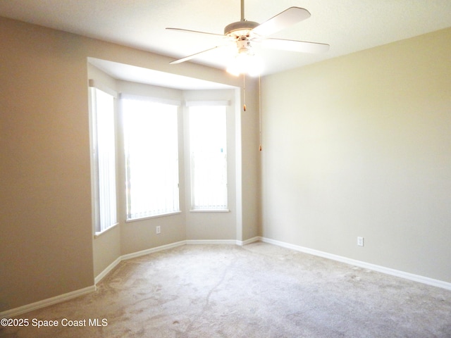 4590 Brantford Ct, Rockledge, FL 32955 - empty room with carpet floors, ceiling fan, and baseboards