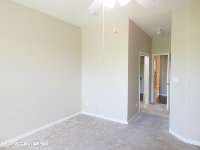 4590 Brantford Ct, Rockledge, FL 32955 - spare room with light carpet, ceiling fan, and baseboards