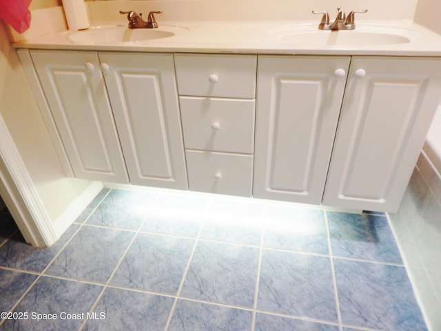 4590 Brantford Ct, Rockledge, FL 32955 - full bathroom featuring a sink and tile patterned flooring