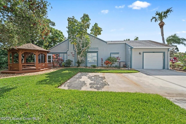 view of front of home featuring an attached garage, a gazebo, concrete driveway, and a front yard