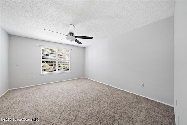 unfurnished room with a textured ceiling, carpet, a ceiling fan, and baseboards