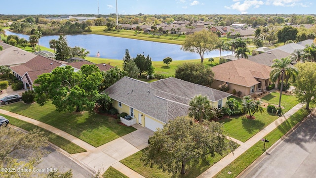 bird's eye view featuring a water view and a residential view