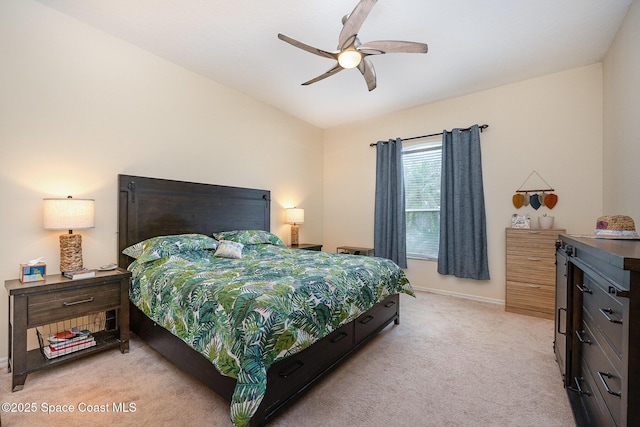 bedroom with baseboards, vaulted ceiling, a ceiling fan, and light colored carpet