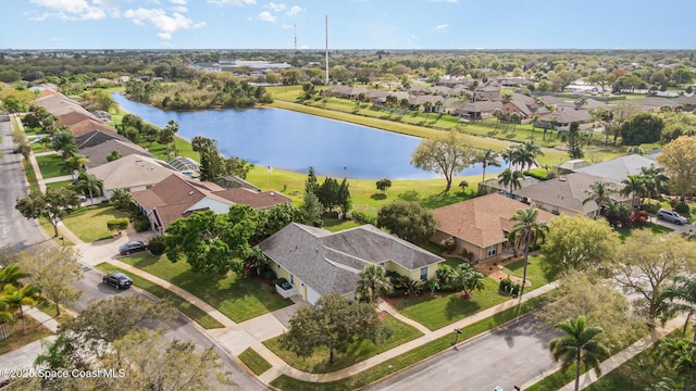 bird's eye view featuring a water view and a residential view