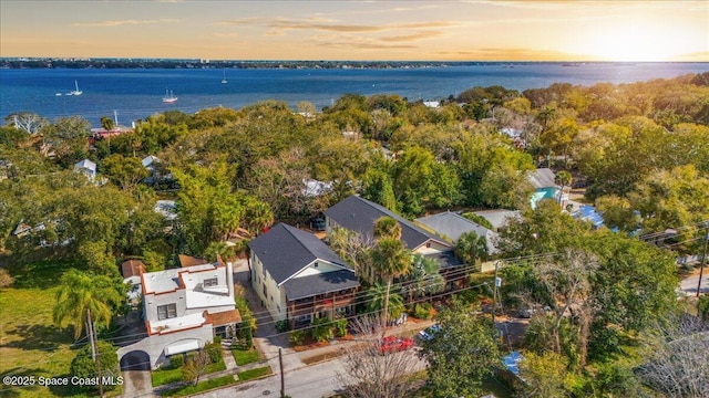 aerial view at dusk with a water view