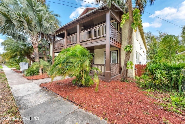 16 S St, Rockledge, FL 32955 - exterior space featuring a balcony, covered porch, and stucco siding