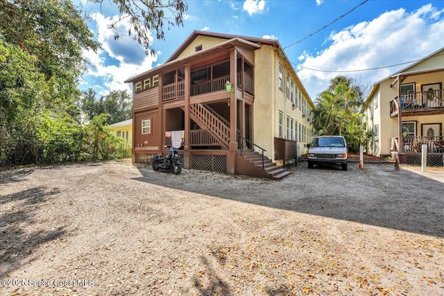 16 S St, Rockledge, FL 32955 - exterior space with driveway and stairs
