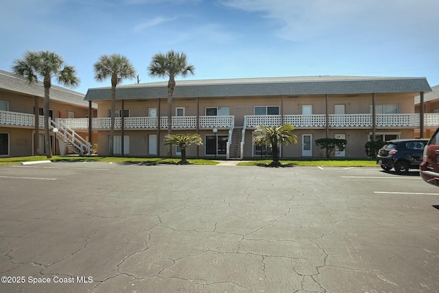 view of property featuring uncovered parking