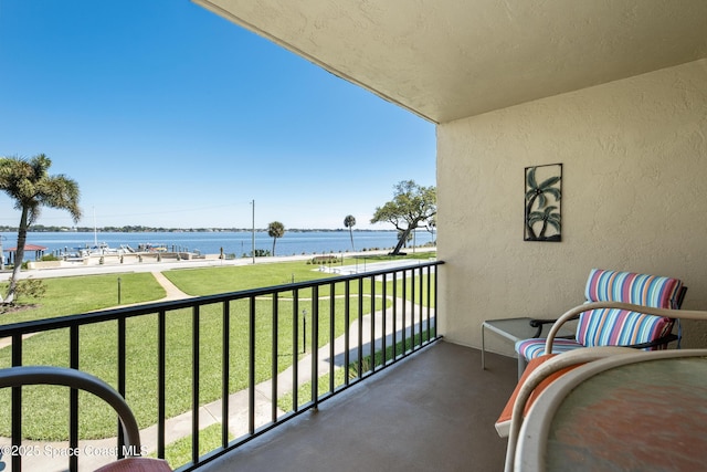 balcony featuring a water view