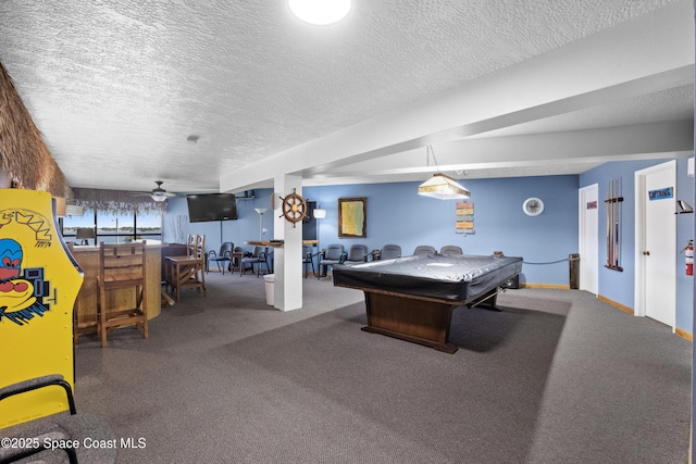 playroom with a textured ceiling, pool table, and carpet