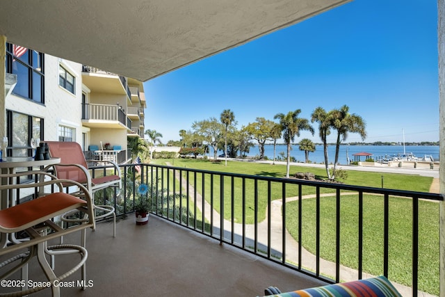 balcony featuring a water view