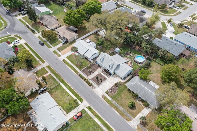 birds eye view of property with a residential view