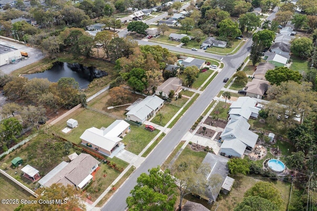 bird's eye view featuring a water view and a residential view