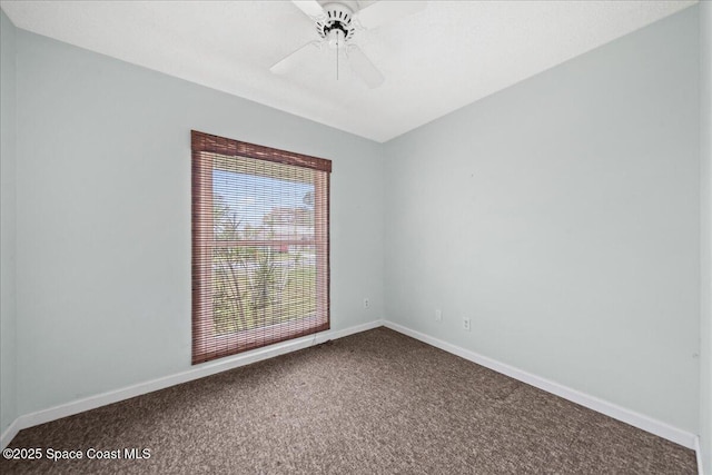 spare room with carpet flooring, ceiling fan, and baseboards