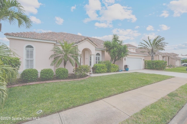 mediterranean / spanish house with stucco siding, concrete driveway, a front yard, a garage, and a tiled roof