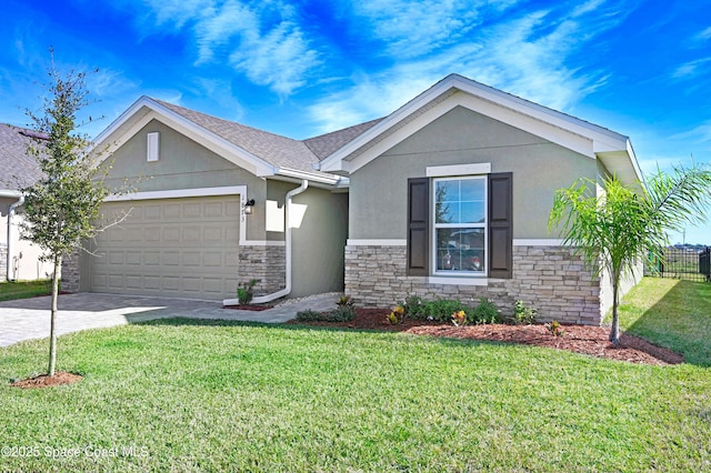 view of front of house with stone siding, a front yard, and stucco siding