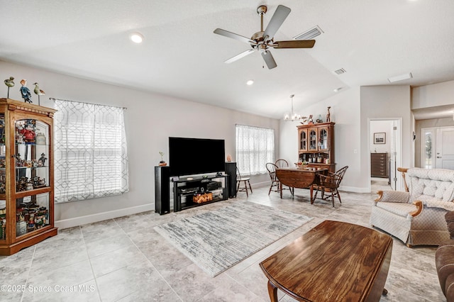 living room with light tile patterned floors, baseboards, visible vents, vaulted ceiling, and ceiling fan with notable chandelier