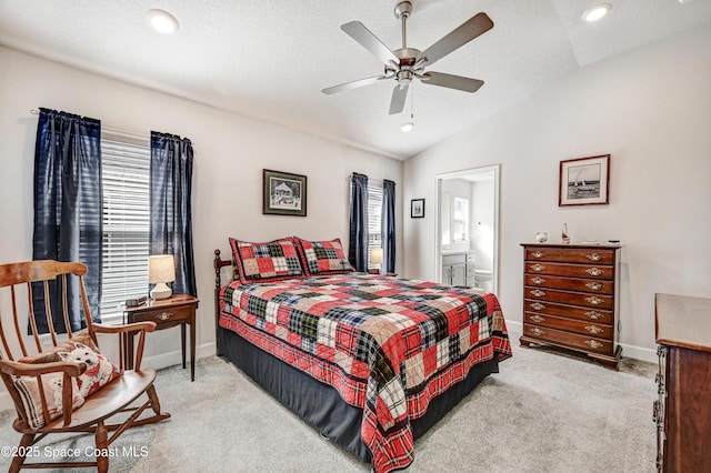 bedroom featuring lofted ceiling, carpet flooring, a textured ceiling, and baseboards