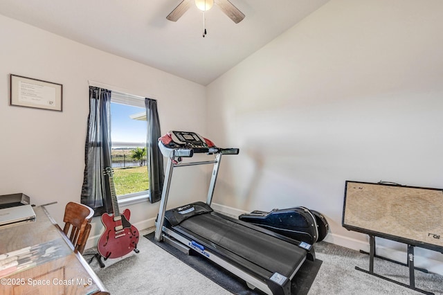 workout room with lofted ceiling, carpet, baseboards, and ceiling fan