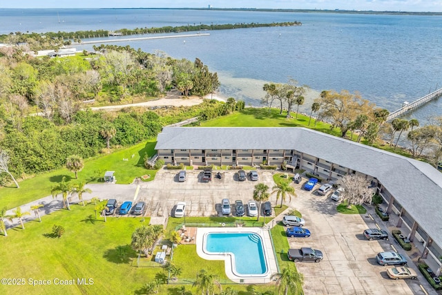 birds eye view of property with a water view