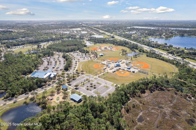 birds eye view of property featuring a water view