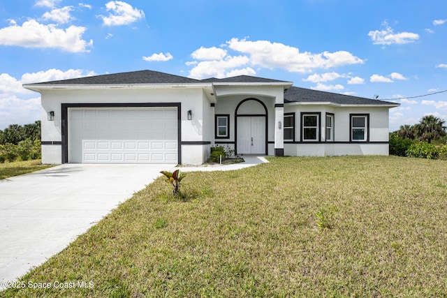 view of front of home featuring a garage, concrete driveway, a front lawn, and stucco siding