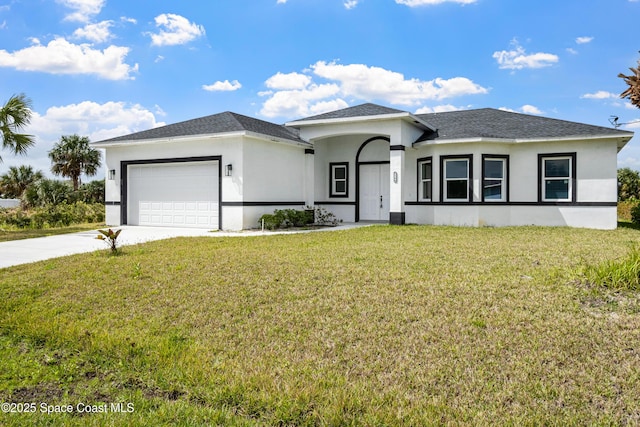 view of front of property featuring a garage, a front lawn, concrete driveway, and stucco siding