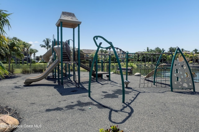 community jungle gym featuring fence