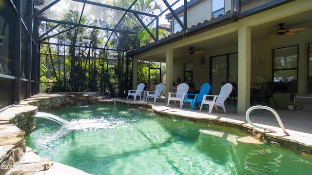 outdoor pool with a patio area, a lanai, and a ceiling fan