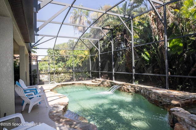 outdoor pool with a lanai and a patio