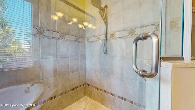 full bathroom featuring a tile shower