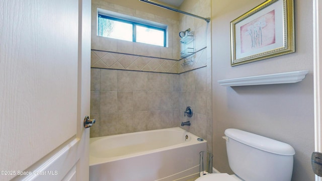 bathroom featuring toilet and shower / bathtub combination