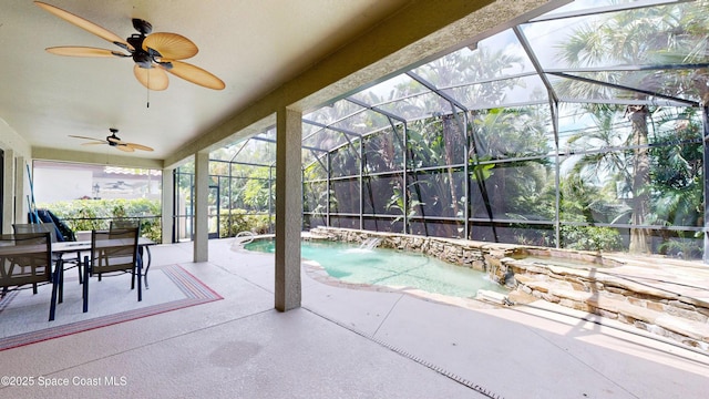 view of patio / terrace with glass enclosure, ceiling fan, and an outdoor pool