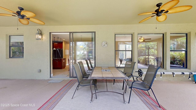 view of patio / terrace featuring ceiling fan