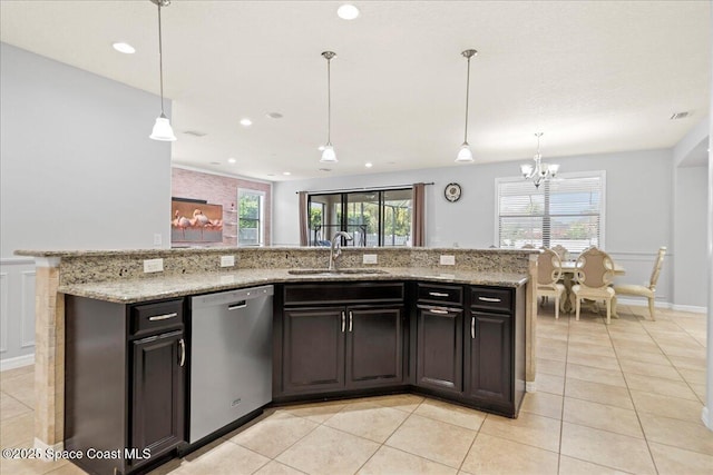 kitchen with a wealth of natural light, light tile patterned flooring, dishwasher, and a sink