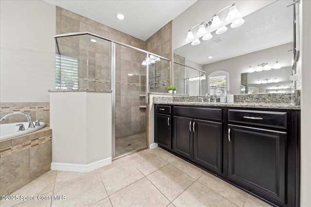 full bath featuring a stall shower, tile patterned flooring, and vanity