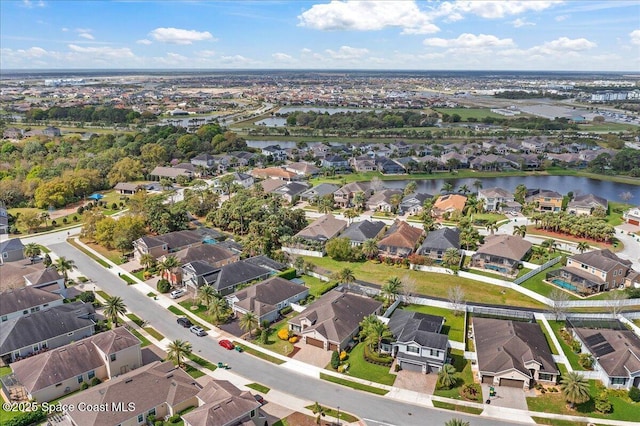 birds eye view of property featuring a residential view and a water view