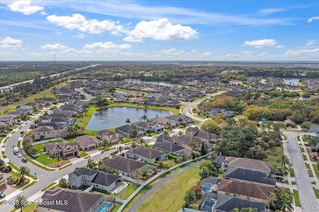 birds eye view of property with a residential view and a water view