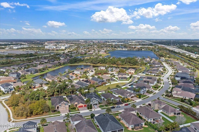 aerial view featuring a water view and a residential view