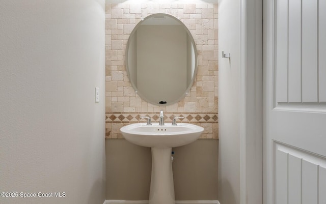 bathroom featuring backsplash