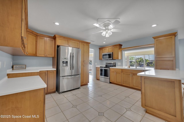 kitchen with light countertops, recessed lighting, a ceiling fan, and appliances with stainless steel finishes