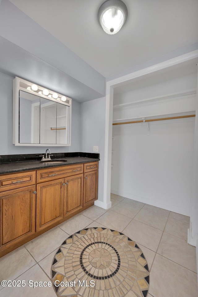 bathroom featuring tile patterned floors and vanity