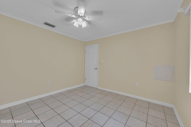 spare room with visible vents, baseboards, ceiling fan, and ornamental molding