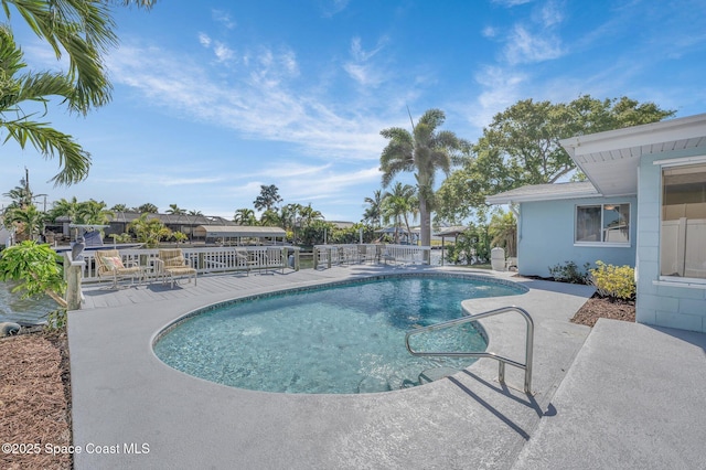 view of pool with a patio area and a fenced in pool