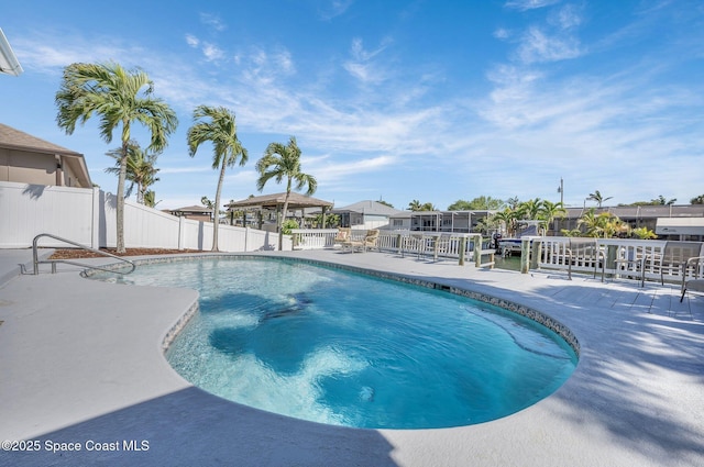 view of swimming pool with a gazebo, a fenced in pool, a patio, and a fenced backyard