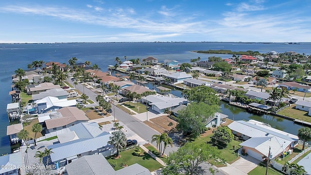 birds eye view of property featuring a residential view and a water view