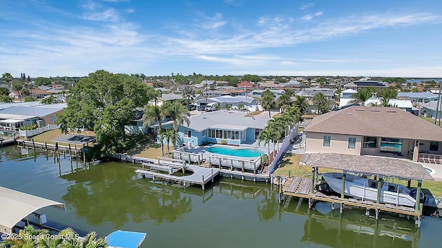 birds eye view of property featuring a residential view and a water view