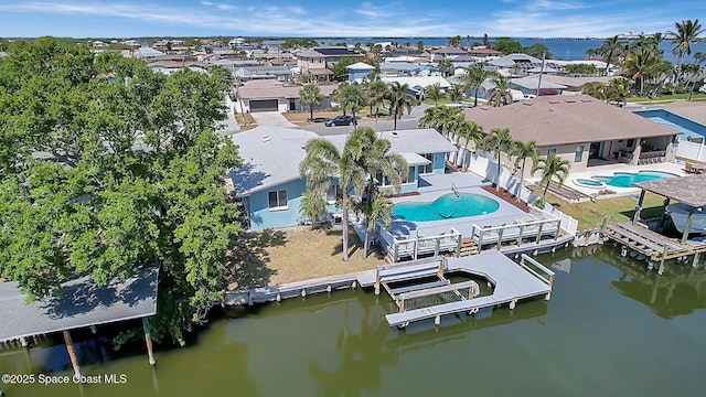 bird's eye view featuring a residential view and a water view